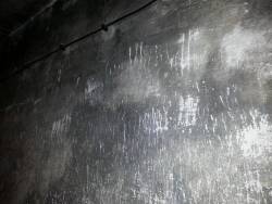  Scratches at the wall of the gas chambers in Auschwitz. 