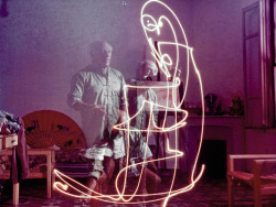 historicaltimes:  Picasso drawing with light in a triple exposure