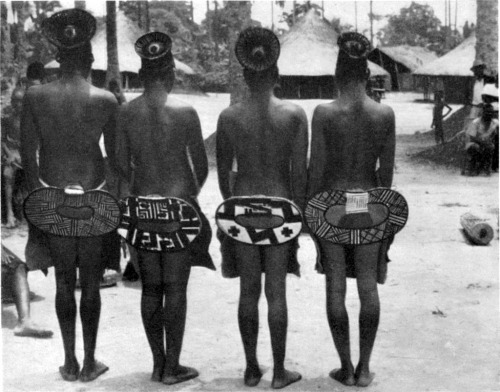 From collection of old photosMangbetu women (back)Mangbetu women beautify not only their heads but their rears. These beautifully woven nekbwe move in a subtly erotic fashion during tribal dances.(Zanzabuku. Lewis Cotlow)
