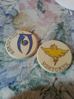 Woodburned Elder Scrolls school of magic pendants/keychains!