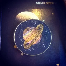 enidtwigletembroidery:  Hand embroidered Saturn with glow in
