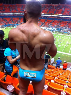 a back shot of the hot dolphins dude
