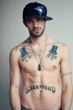 bisexland:  Sexy tattooed and bearded guy shirtless.