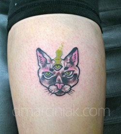 dmillust:  Tiny cat head tattoo!!! Done on an awesome friend