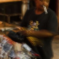 Metal toy seller. This guy was collecting used chopsticks that