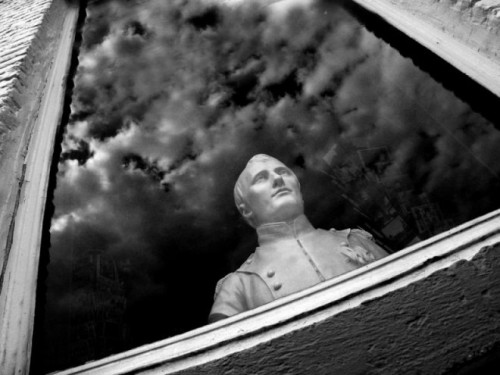 His head’s in the clouds (bust of Napoleon surrounded by sky reflection)