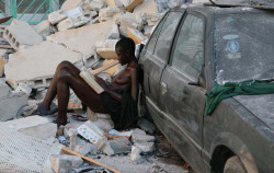 woman reading in the aftermath of the earthquake (2010), haiti