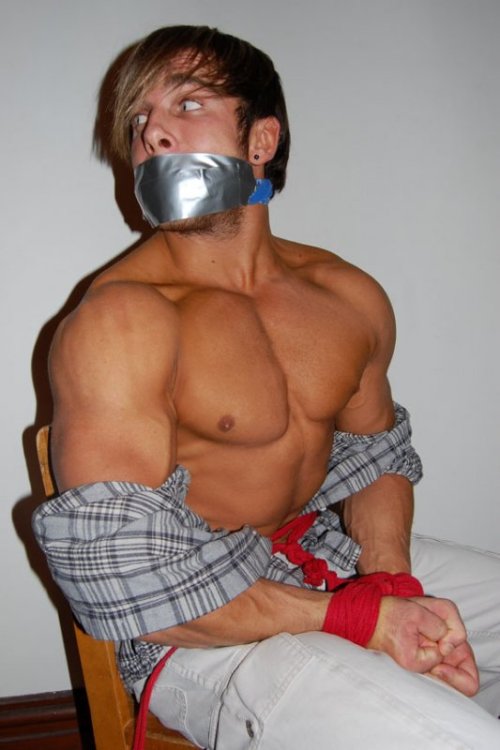 coolballgagbro:  Despite using all the energy he could muster, the landlord had done too good a job of trussing up Marcus. As he heard the key turn in the lock of his new apartment, Marcus knew his last chance of escape had passed. Stripped to his skivvie