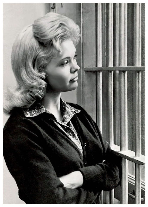 THESE BARS AREN’T CANDY  Vintage press photo dated from October of ‘57, features Candy Barr behind the bars of a courthouse prison, after losing an appeal to overturn a ridiculous 15-year sentence for marijuana possession.. Many speculate that