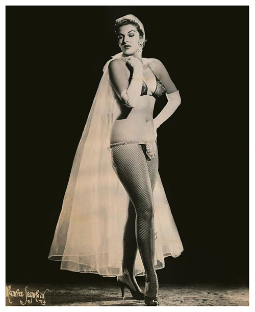 Norma Arden Norma is seen here, wearing a costume detail that Dixie Evans referred to, as a: “Flipper”.. A small half-moon piece of heavy fabric belted to the waist.. A small weight was sewn into the lower-half, which Dixie suggested was usual