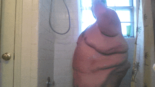 smother-me-in-ur-blubber:  fatmov:  superchub shower   Look at that massive low hanging belly and those enormous tits. WOOF.Â   