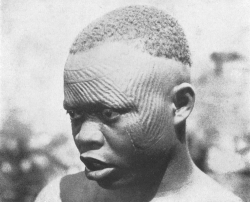 ukpuru:  Igbo youth with solar/lunar ichi marks. The marks are
