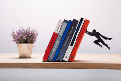 itscolossal:  Bookshelf Superheroes Appear to Save Your Favorite