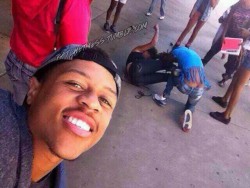 ratchetmess:  This man is taking selfies while his wifey and