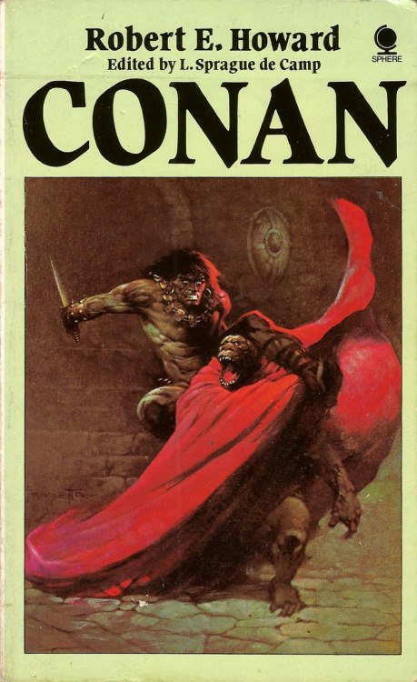 Conan, by Robert E. Howard (Sphere, 1985). Cover art by Frank Frazetta. From a charity shop in Sheffield.  Conan had locked his legs about the ape-man’s torso and was striving to maintain his position on the monster’s back while he butchered