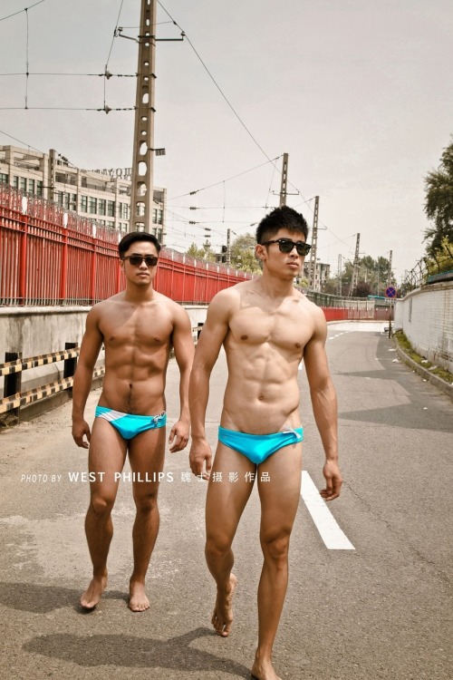 bbbtm13:  Hot guys in sexy trunks on the street, by West Phillips  Reblog & follow me for more surprise!