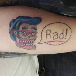 A recent tattoo of a rad zombie skull.   Client came in with