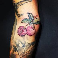 cutelittletattoos:  Cross stitch cherry tattoo on the right elbow.