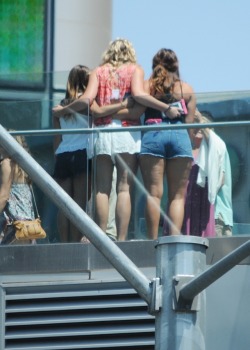 I saw these girls posing for a picture on the pedestrian bridge