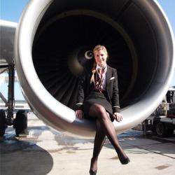 Beautiful Flight Attendant Aircraft girl ready to fly in the