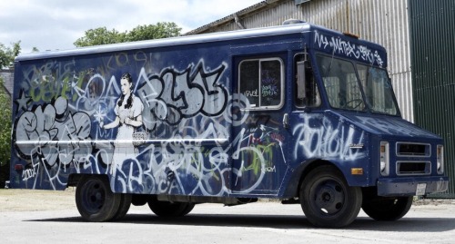 carsthatnevermadeitetc:  GMC SWAT van, 1985 (2006), by Banksy. An artwork by the British artist is to be auctioned by Bonhams tomorrow with an estimate of 跂-430,000. The van depicts a little boy about to prank a SWAT team on one side, and Dorothy from