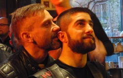 Leatherman whispering naughty things into his boy’s ear.