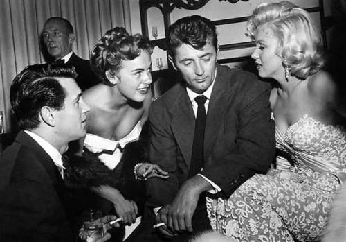 Rock Hudson, Terry Moore, Robert Mitchum and Marilyn Monroe.