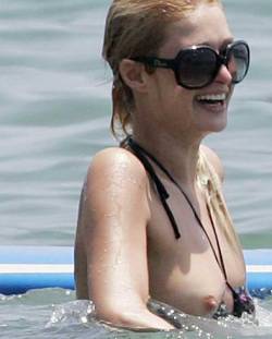 starprivate:  Paris Hilton topless boobs in the water  A Paris