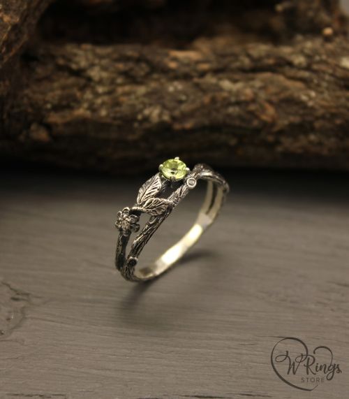 littlealienproducts:    Dainty branch and leaves peridot ring by