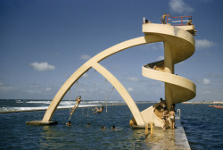 natgeofound:  Children swim and play in oceanside pool, February