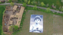 slimediner:  Artists install massive poster of child’s face