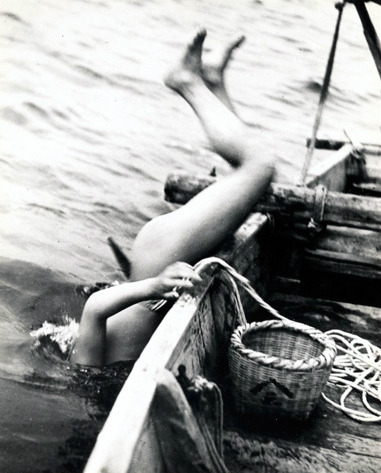 thekimonogallery:  A Japanese ‘Ama’ (female diver) goes overboard in search of shellfish. 1930s, Japan.  