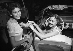 fuckyeahvintage-retro:  Two girls at a local drive-in, 1957 (via)