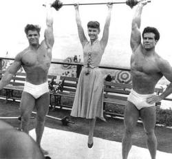 don56:  Body builders Dick Dubois and Steve Reeves host Debbie