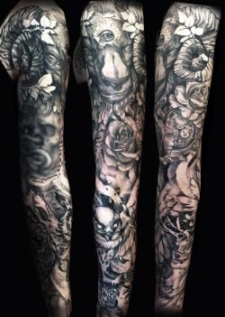 fuckyeahtattoos:  Healed sleeve done, 60% freehand work, skull