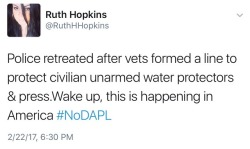 nativenews:  Veterans form a line around water protectors   Police