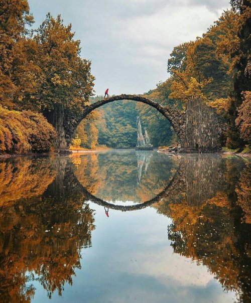 jonlovett: jengatower:  burntcopper: Kromlau bridge, Germany, during all four seasons. Is this real???  holy shit 