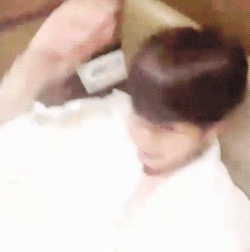 exoturnback:  baekhyun in bed in just a bathrobe… ¬‿¬ 