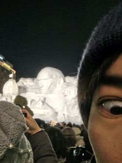 Isayama Hajime shares a selfie in front of the Colossal Titan
