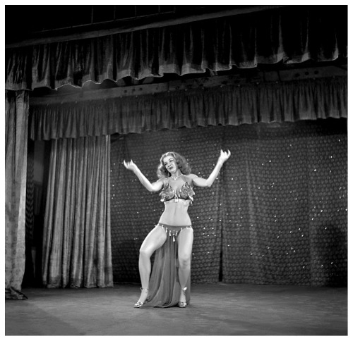 Tempest Storm  Appearing in a publicity still for the 1953 Burlesque film: “A NIGHT IN HOLLYWOOD”.. The film was shot at the ‘FOLLIES Theatre’; located in downtown Los Angeles..       