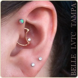 lasvegastattooco:  Dreamy daith moon by Body Gems in 14k yellow