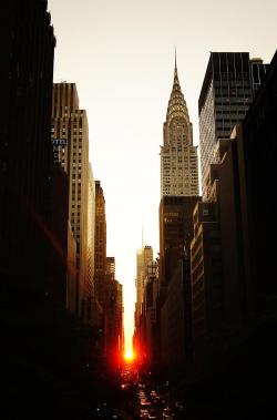 travelingcolors:  Manhattanhenge sunset and the Chrysler Building