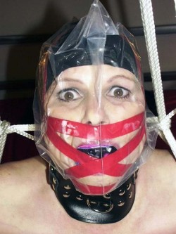 Before I bag a woman I often gag her first. That way its impossible for her to chew on the bag! Bondage and fetish images @  Art of Bondage