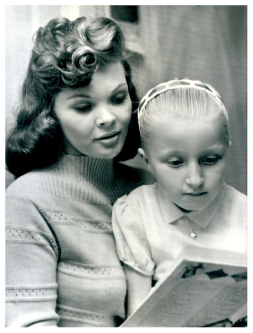 CANDY WANTS A NEW LIFE Vintage press photo dated from February of ‘63, features Candy Barr reading to her 7 year-old daughter: “Troylene”; after being released from Huntsville prison.. Ms. Barr served 3 Years   91 Days of an insane 15-ye