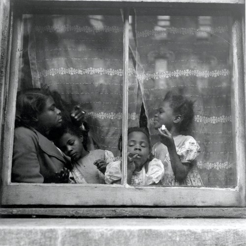 vintageeveryday:A family at a window in their home, Harlem, New