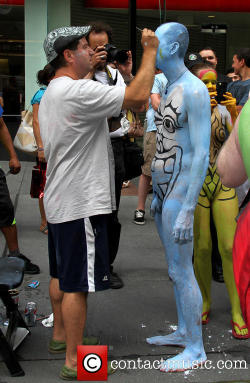 maleinstructor:  Bodypainting artist Andy Golub paints the naked