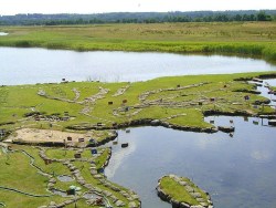 sixpenceee:  A Huge World Map on the Edge of a Lake Along the