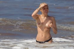 toplessbeachcelebs:  Miley Cyrus (Singer) swimming topless in