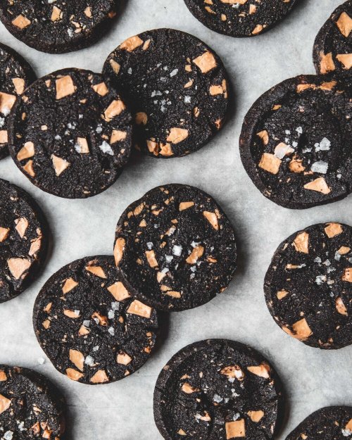 sweetoothgirl:Salted Black Cocoa Sables with Caramelised White