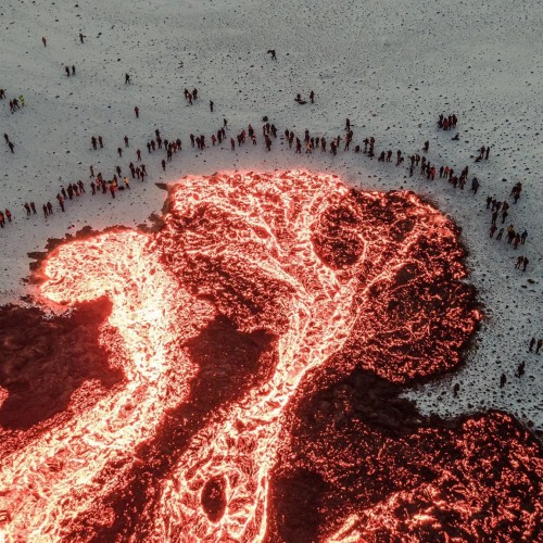 allthingshyper:synqra:  People gathered around lava, Iceland.